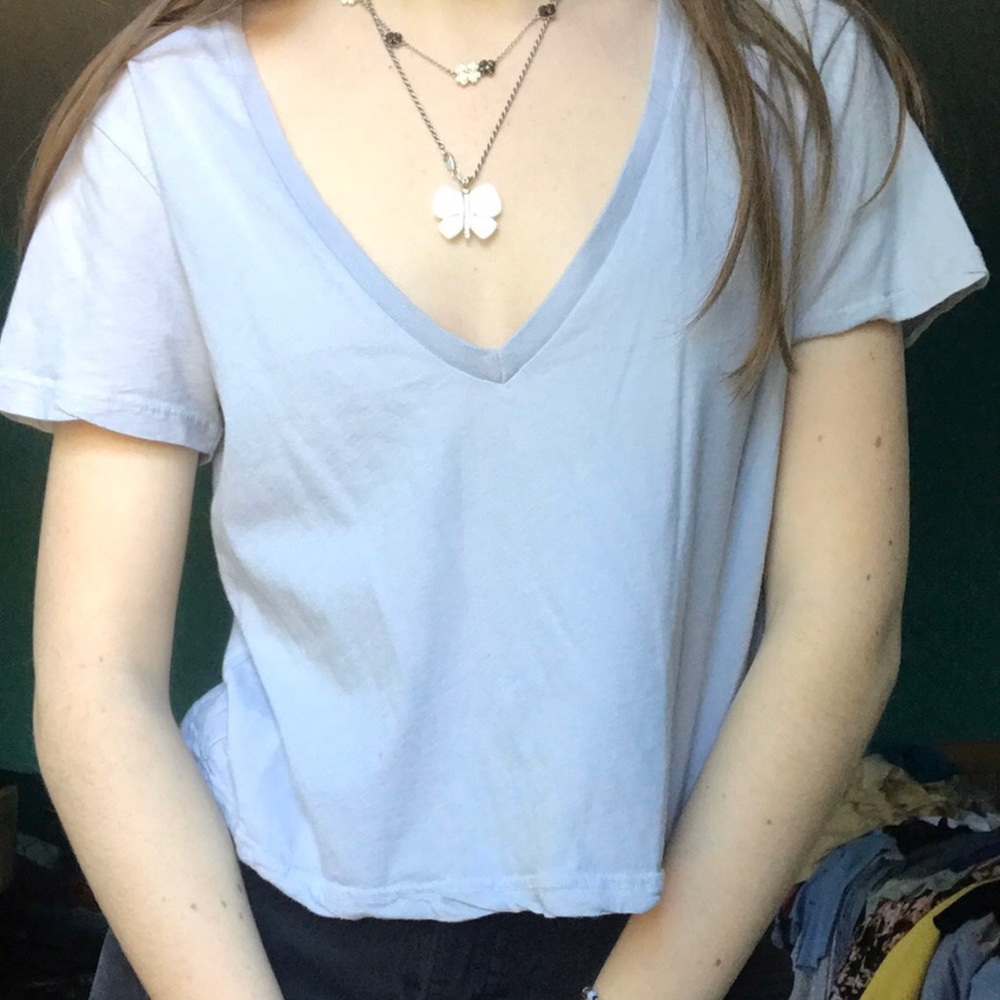 Light blue cropped t-shirt.